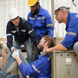 Construction workers assisting an injured colleague during Florida job training.